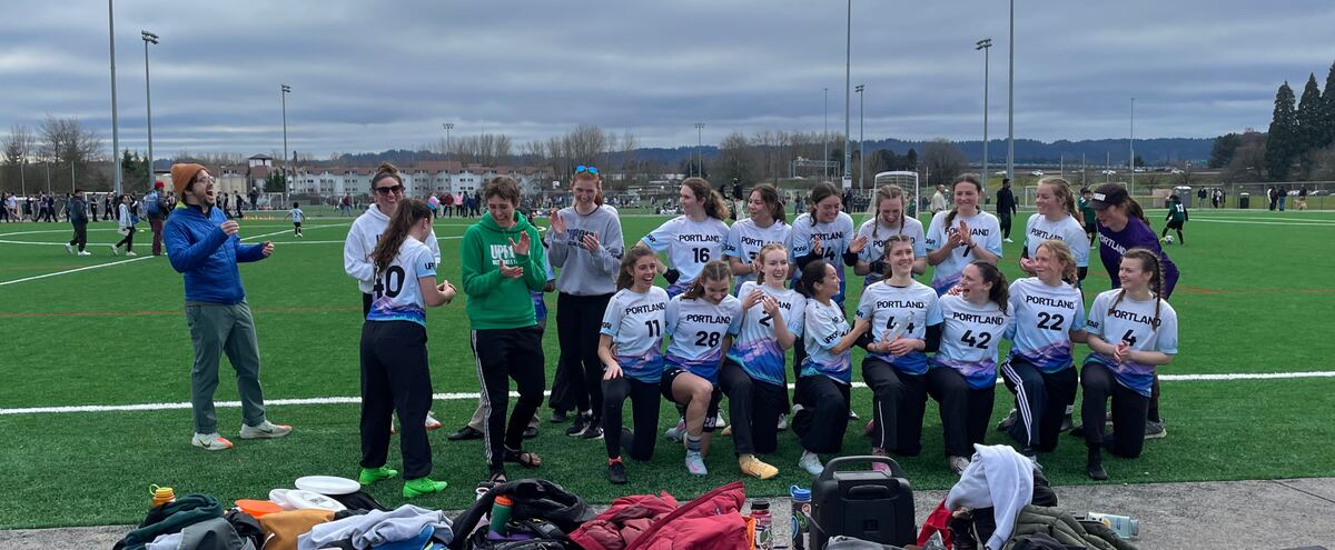 Cara Meyer celebrating with her ultimate frisbee team